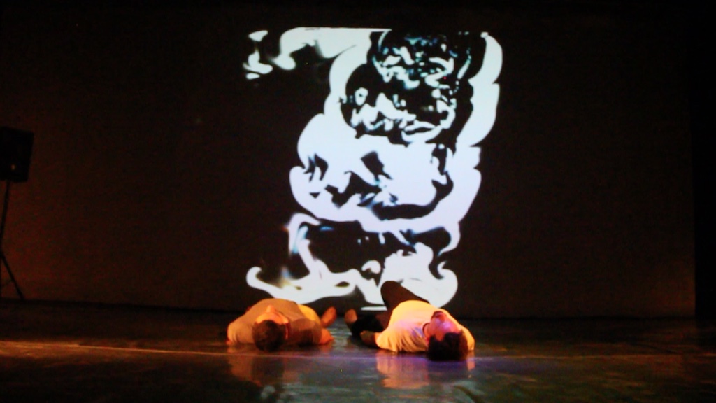 a stage with ripple effects from camera input and optical flow fluid effects